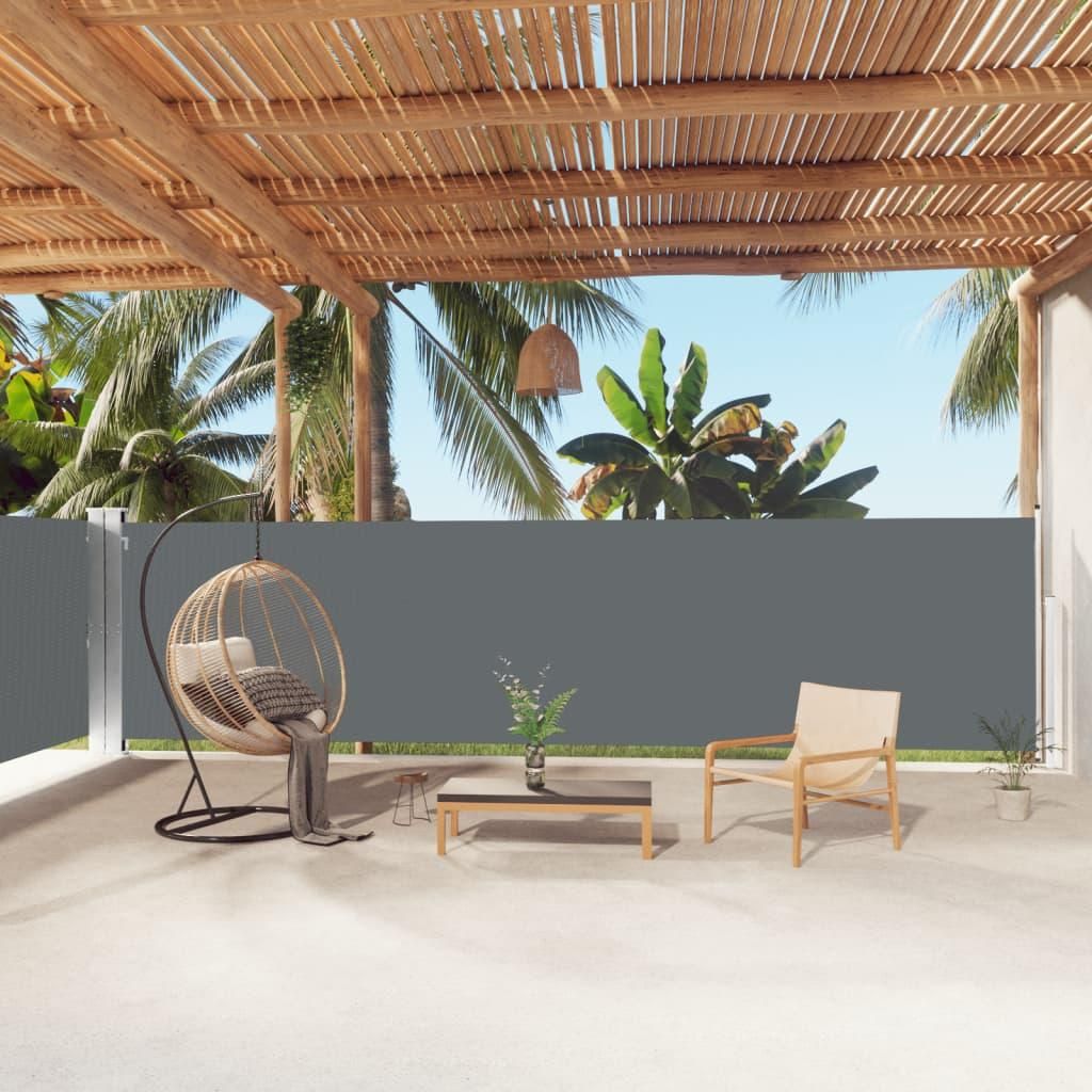 An outdoor patio with furniture and a retractable side awning.