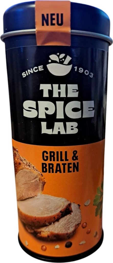 A product shot of a spice tin with an image of roasted meat.