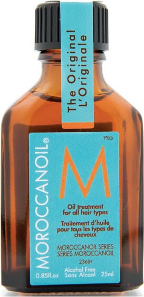 A small amber glass bottle of Moroccanoil hair treatment with a turquoise label.