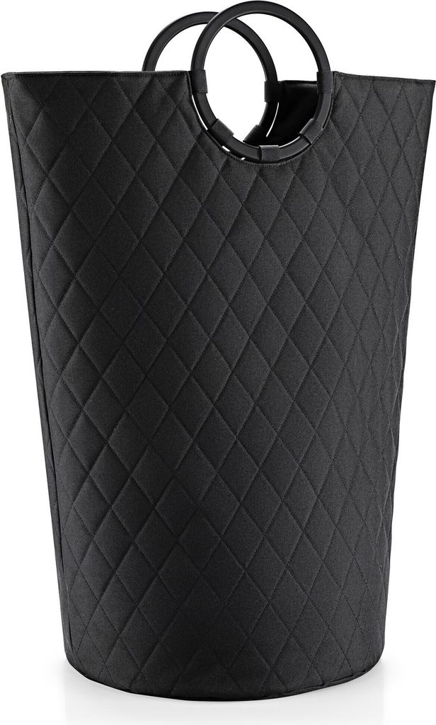 A black quilted laundry basket with round handles.