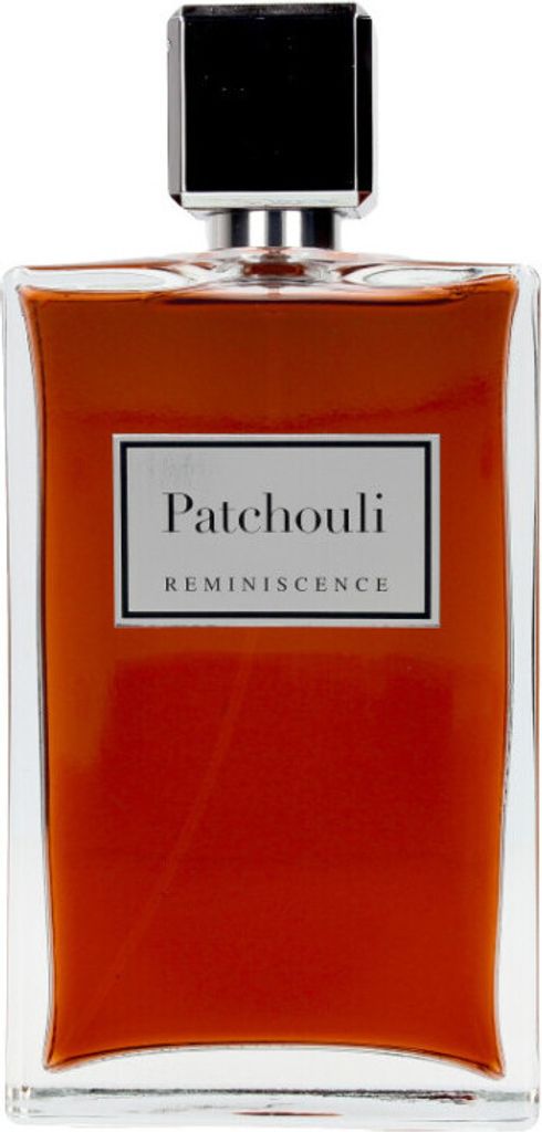 A perfume bottle with a black cap and a clear glass body containing orange-colored liquid.