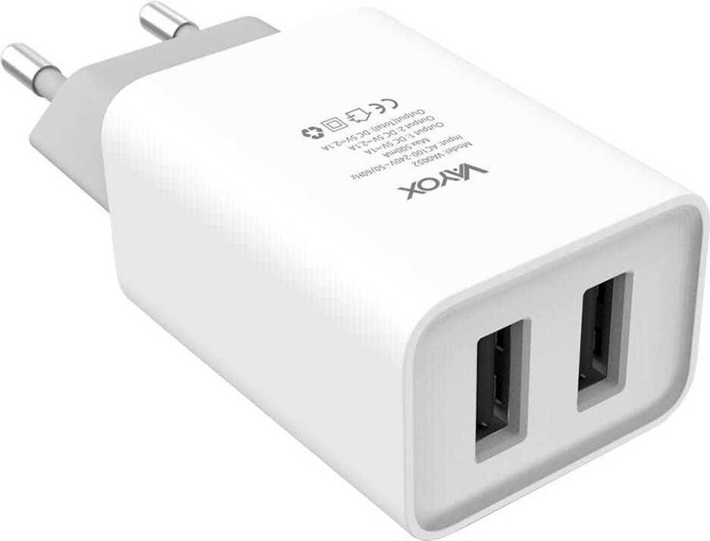 A white dual-port USB wall charger with European plug prongs.