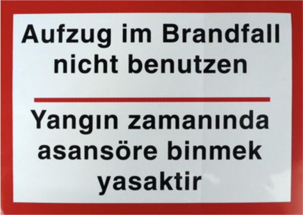 Schild Aufkleber "Aufzug im Brandfall nicht benutzen" zweisprachig dt./ türkisch