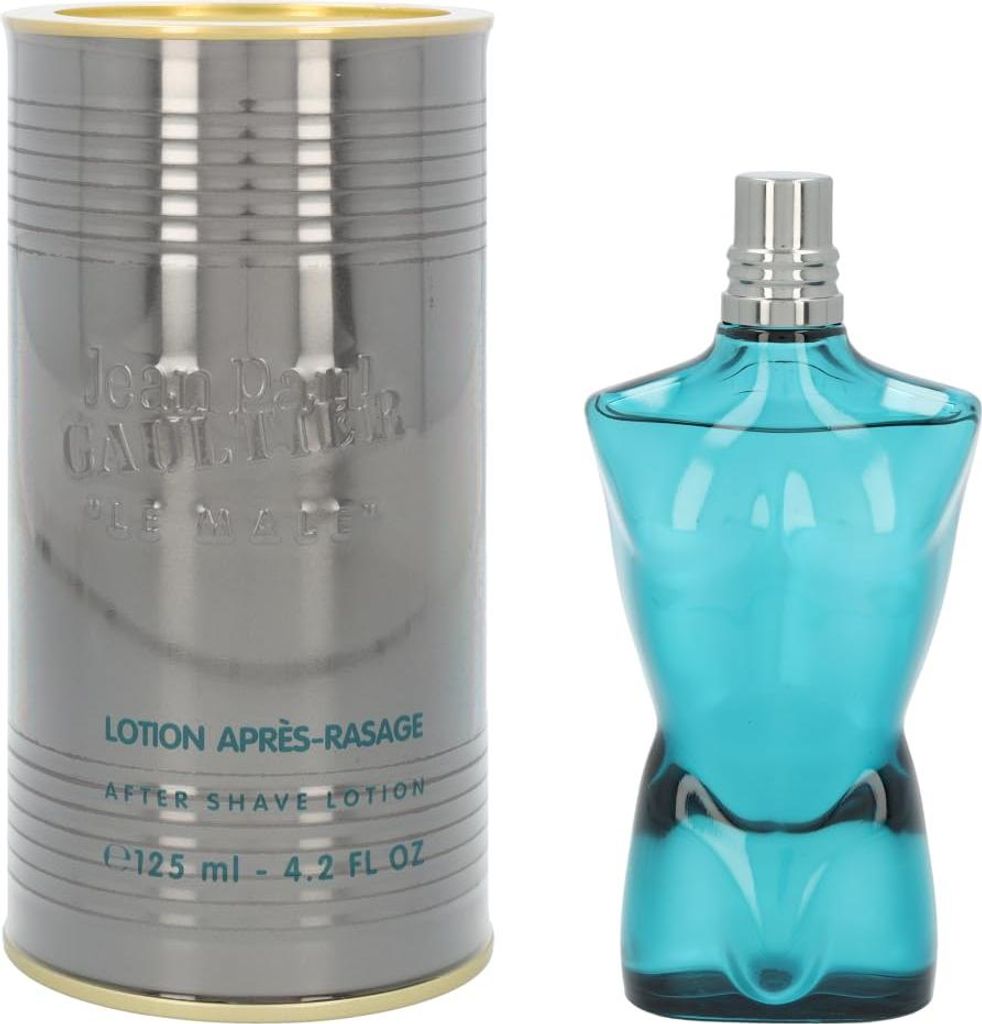 A bottle of Jean Paul Gaultier Le Male aftershave lotion and its cylindrical packaging are displayed side-by-side on a white background.