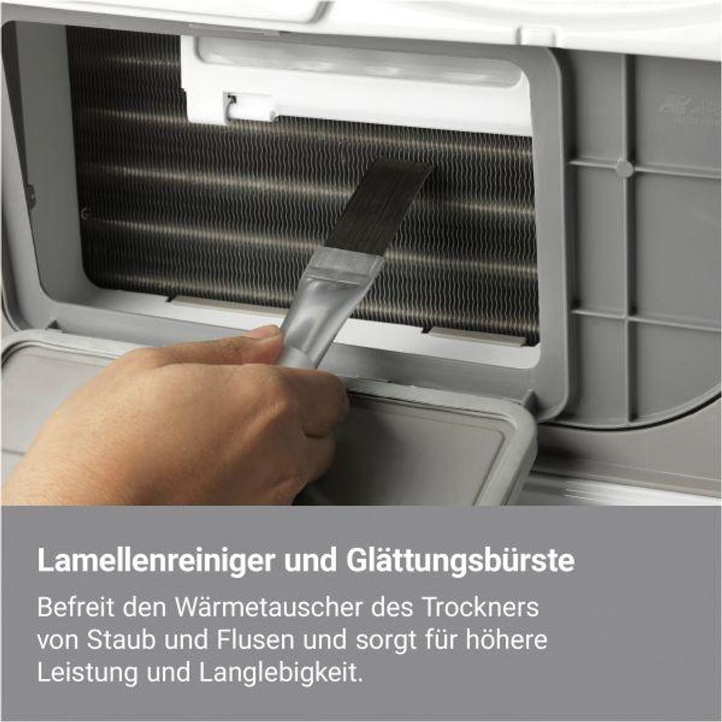 A hand is cleaning the fins of a heat exchanger with a brush.