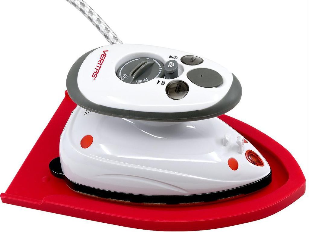 A white and gray Veritas mini steam iron sits on a red ironing board.