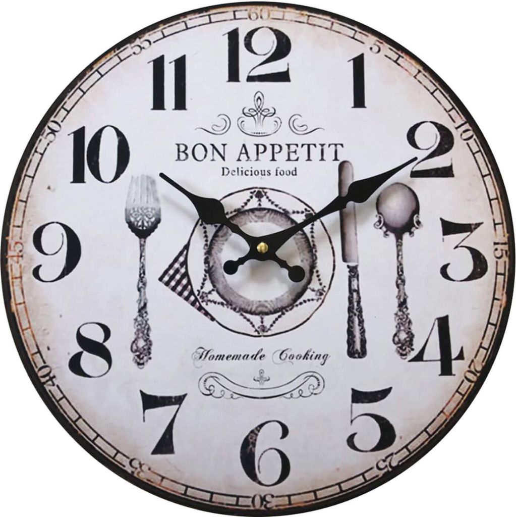 A round wall clock with a vintage design, featuring kitchen-themed illustrations and text.