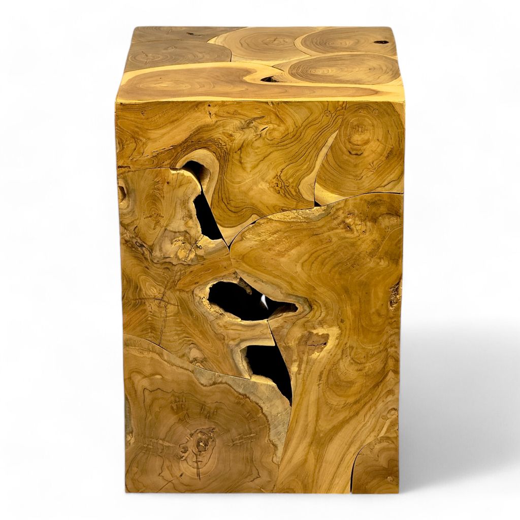 A close-up, studio shot of a wooden side table with a unique, organic design.