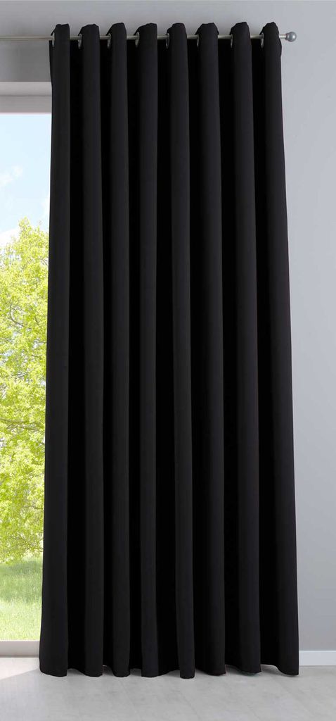 A black curtain hangs in front of a window, with greenery visible outside.