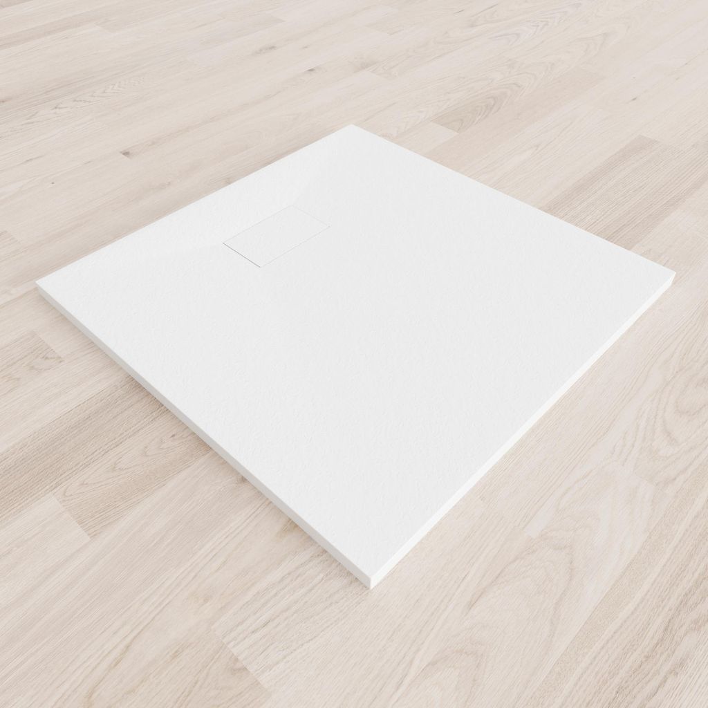 A white shower tray is placed on a light wooden floor.