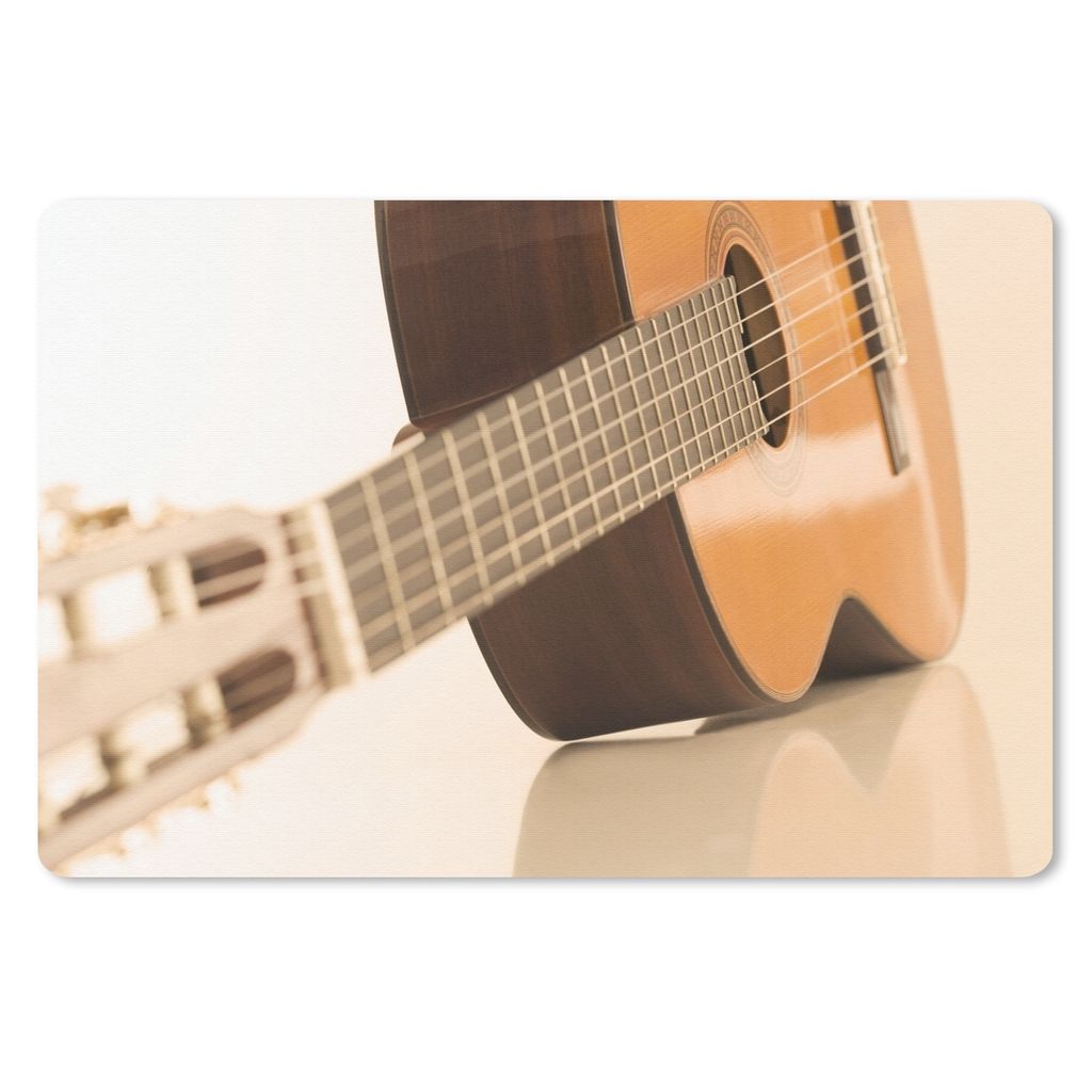 MuchoWow Schreibtischunterlage Eine auf der Seite liegende akustische Gitarre 60x40 cm - XXL Mauspad - Großes Mauspad