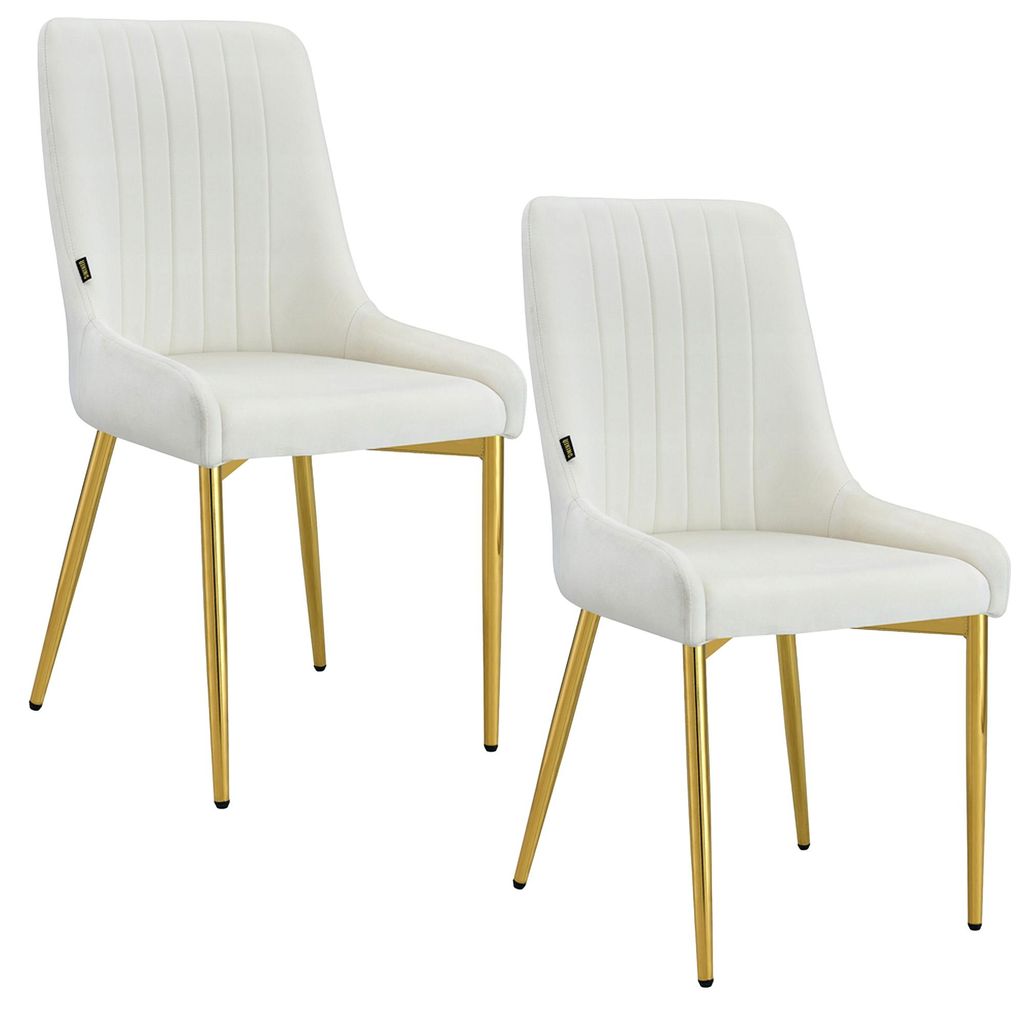 Two cream-colored velvet dining chairs with gold metal legs are shown against a white background.