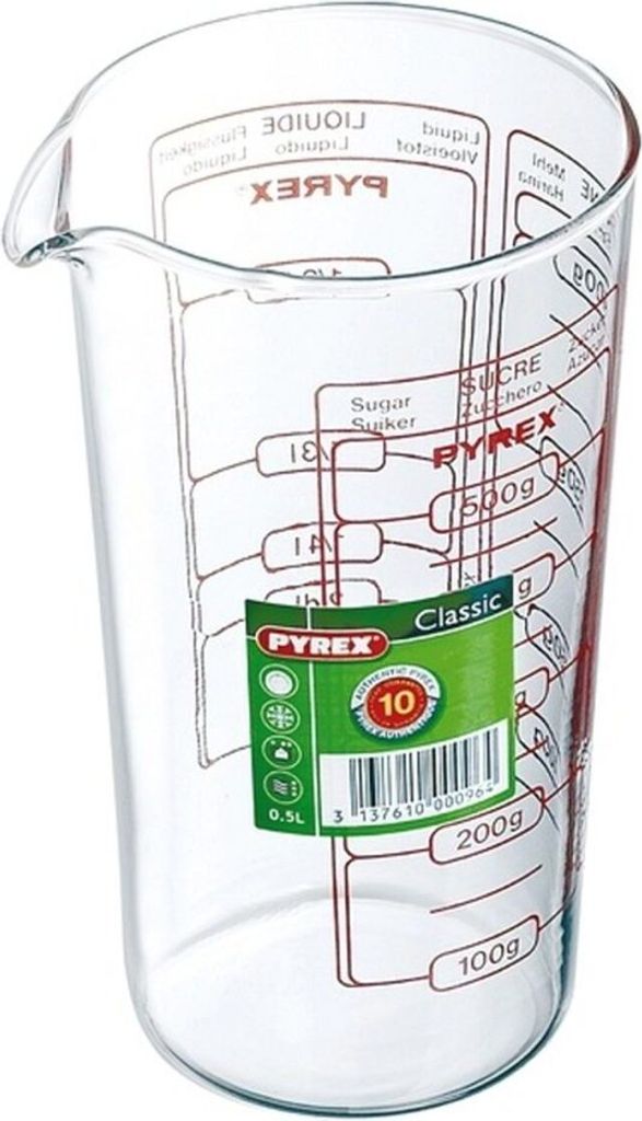A clear glass measuring cup with markings for different measurements.
