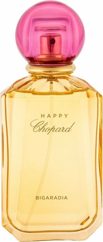 A perfume bottle with a pink cap and yellow liquid.
