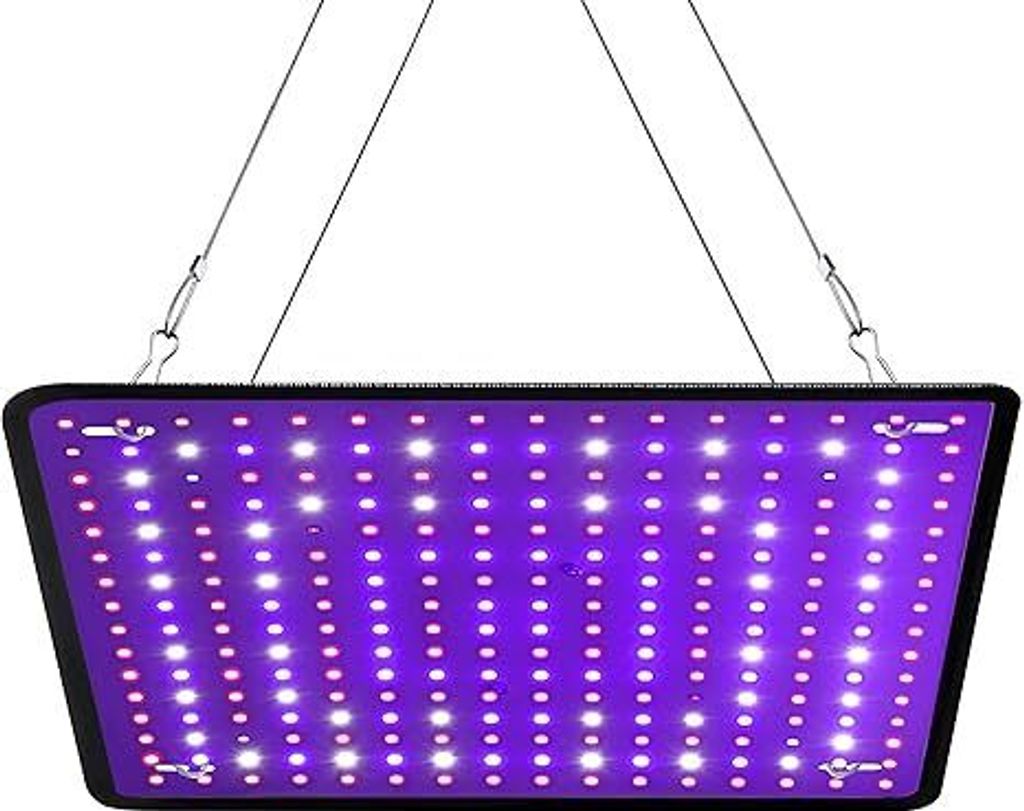 A rectangular LED grow light with purple and white lights, suspended by wires.