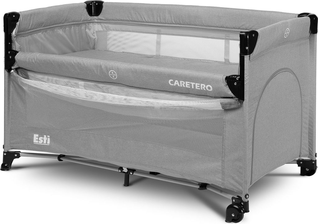 A gray travel crib with a mattress inside, shown from a side angle.