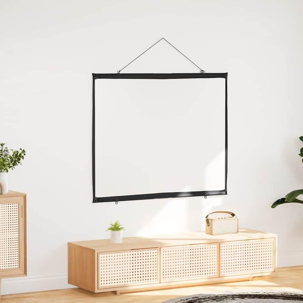A white projection screen is hanging on a white wall above a wooden media console.
