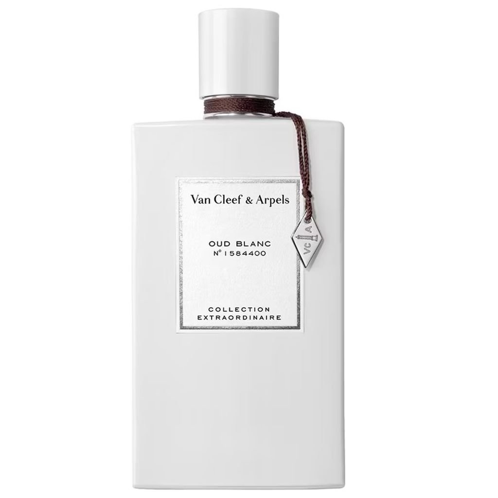 A white perfume bottle with a brown string and a silver charm.