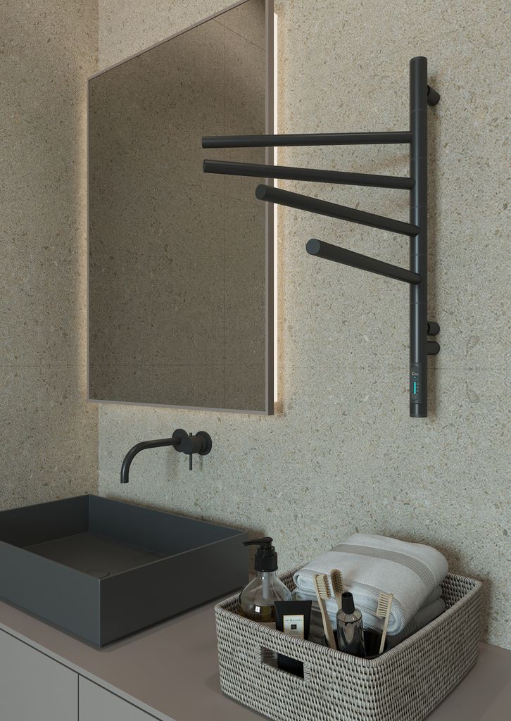A modern bathroom scene featuring a sink, faucet, mirror, and a towel warmer.