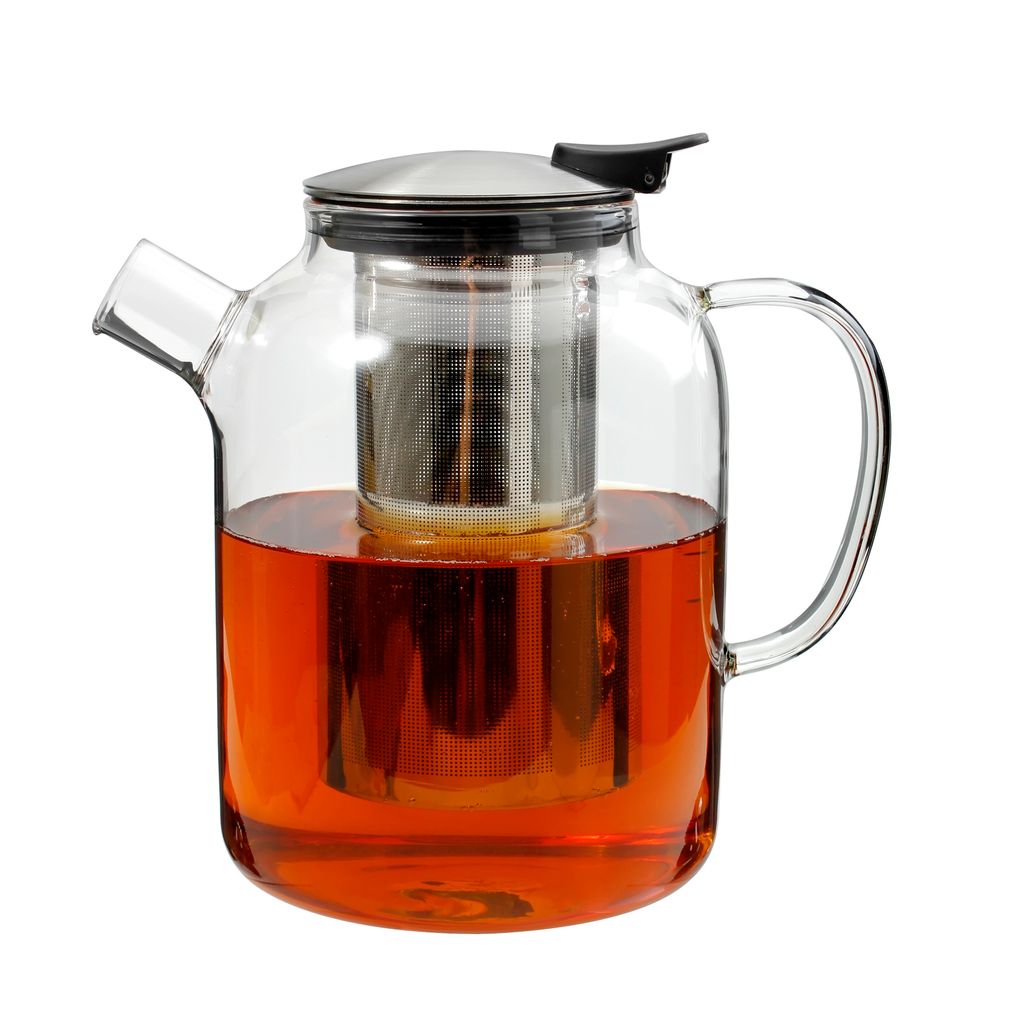 A glass teapot filled with amber-colored liquid, likely tea, with a stainless steel infuser and lid.