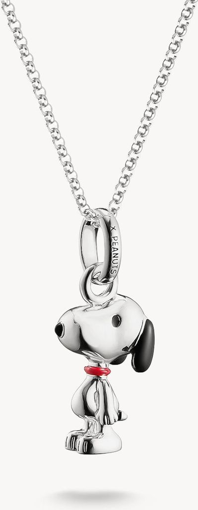 A silver necklace with a Snoopy pendant.