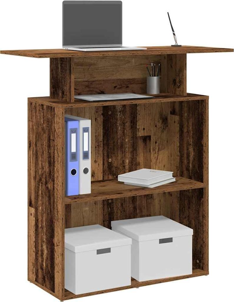 A rustic-looking reception desk with a laptop and office supplies.