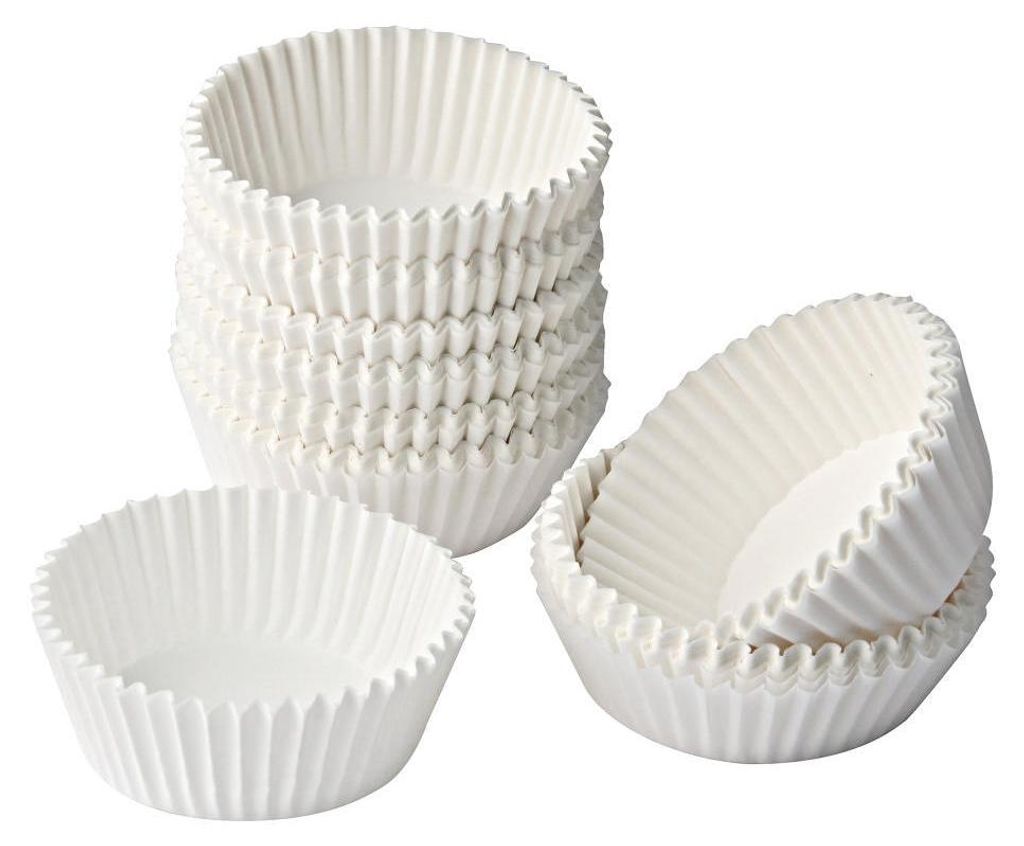 A stack of white paper muffin liners and two individual liners.