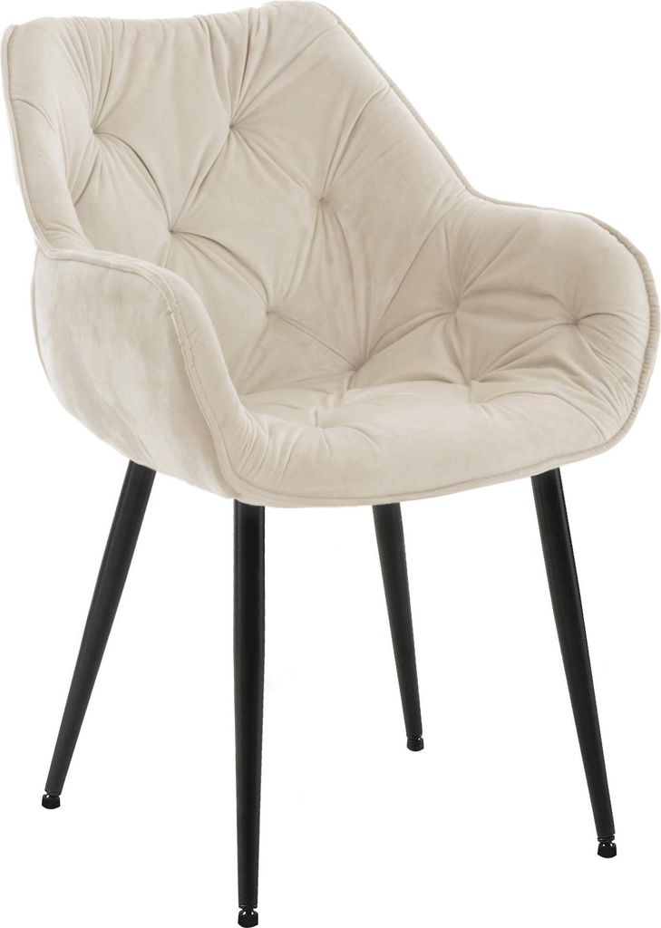 A cream-colored velvet chair with tufted detailing and black legs, presented against a white background.