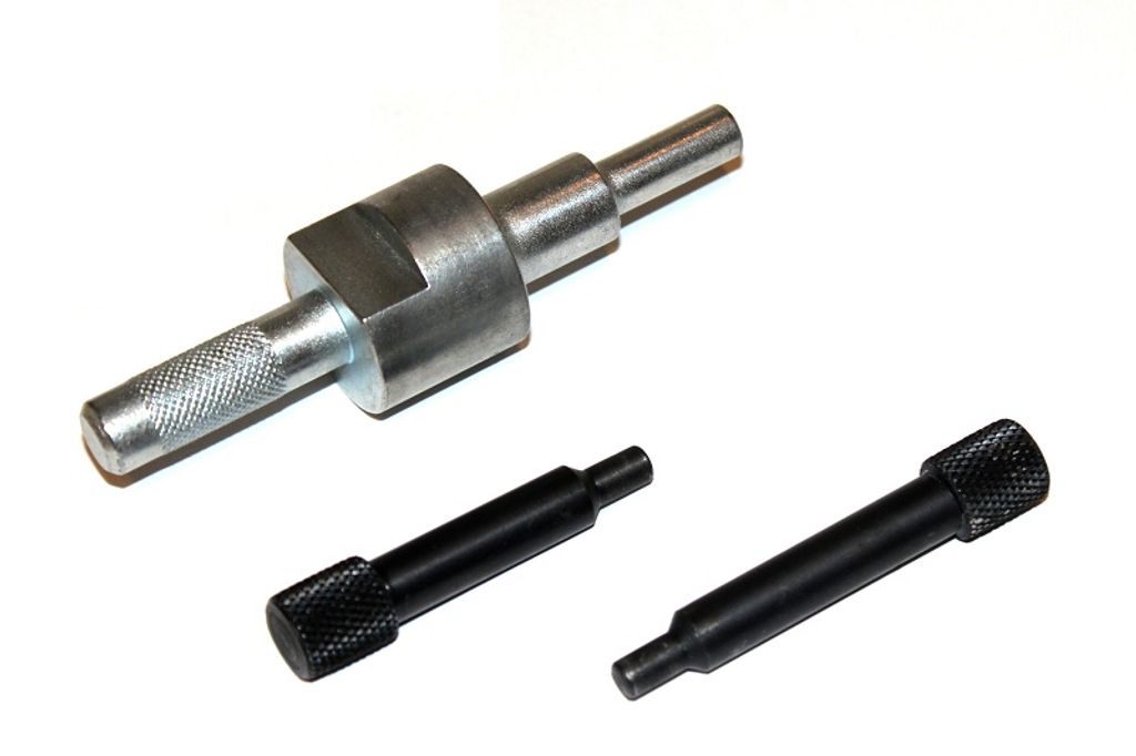 A set of automotive engine timing tools on a white background.