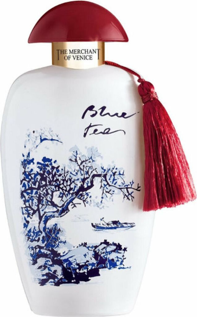 A perfume bottle with a decorative design and tassel.