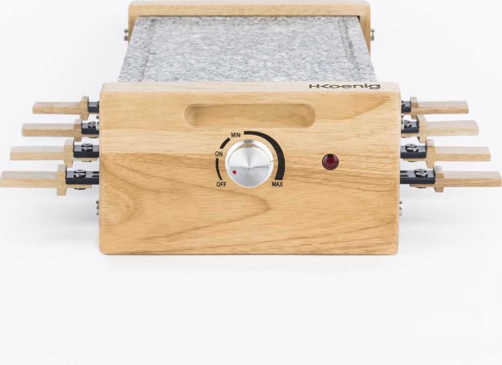 A close-up, front-facing view of a raclette grill with a granite stone cooking surface and wooden handles.