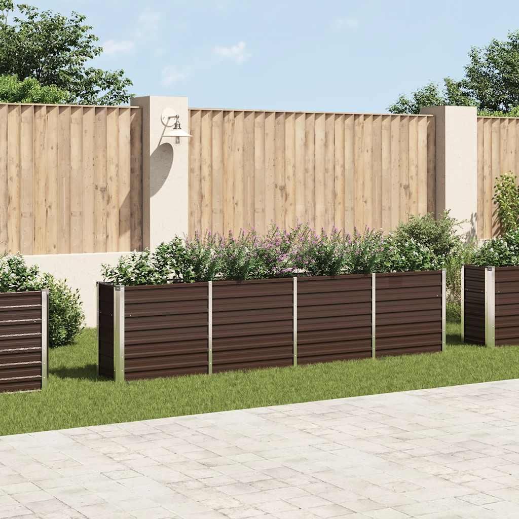 A garden scene with planters and a wooden fence.