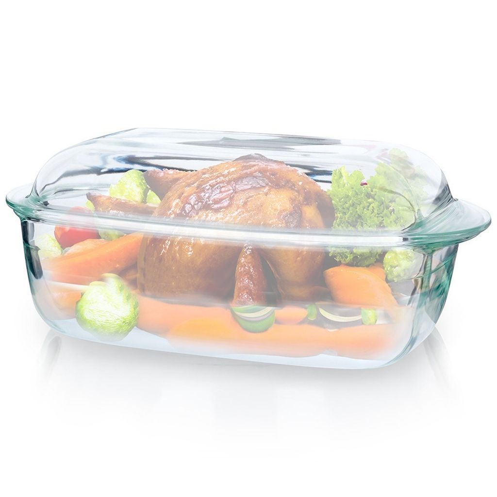 A roasted chicken and vegetables in a glass baking dish.