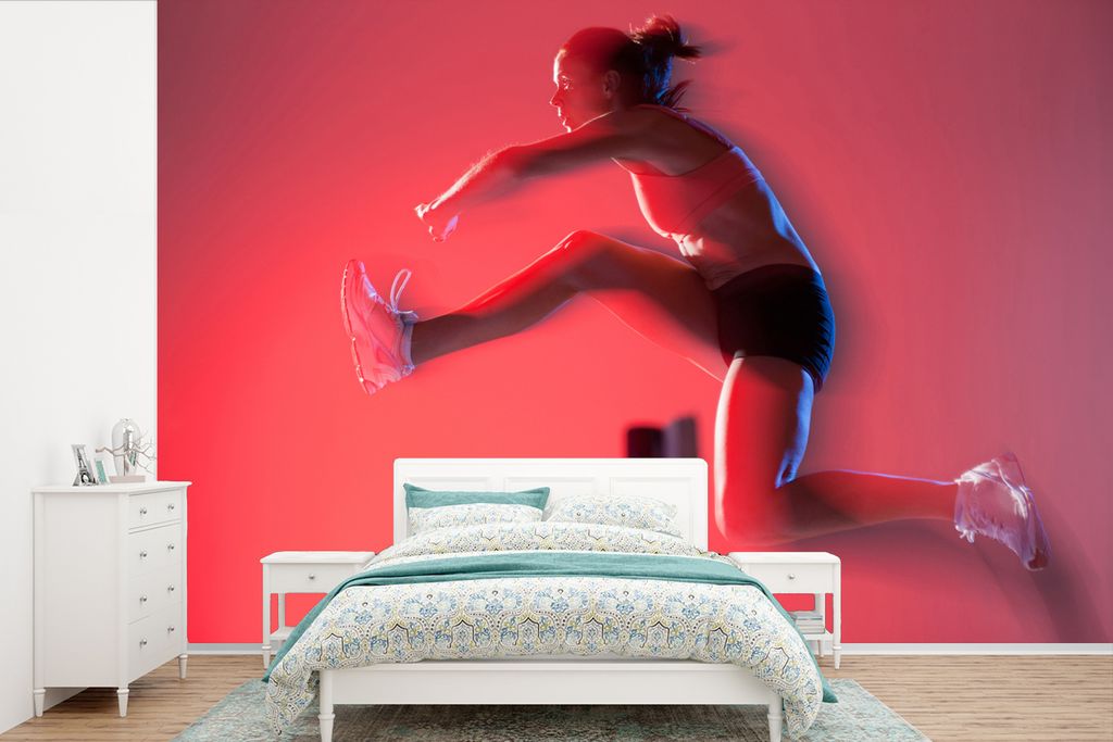 MuchoWow Fototapete für Wohnzimmer oder Schlafzimmer Wandtapete Vinyl Motivtapete Unscharfes Bild eines Hürdenläufers - 525x350 cm - Das Hinte...