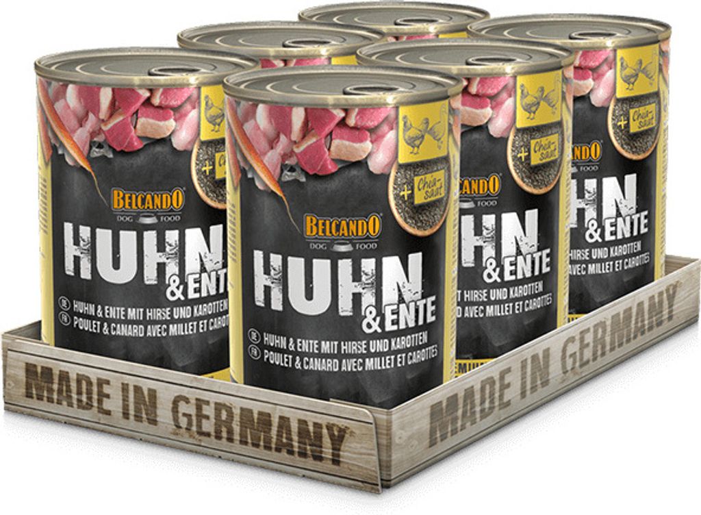 A six-pack of dog food cans in a wooden tray.