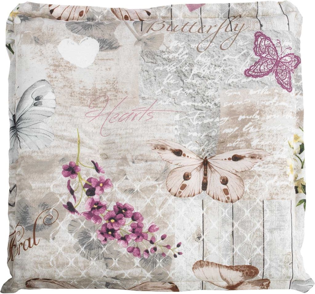 A close-up view of a cushion cover with a butterfly and floral pattern.