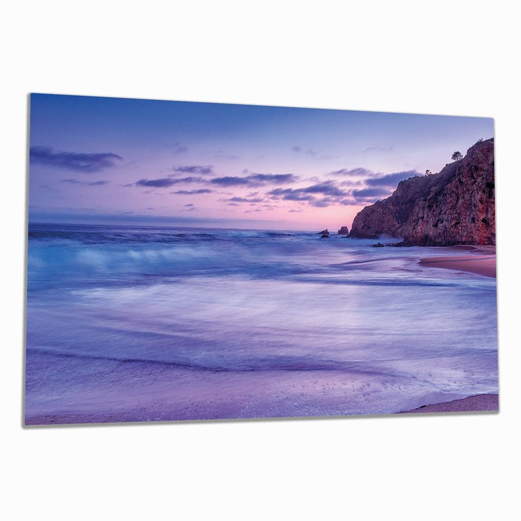 Wallario Herdabdeckplatte aus Glas, Größe 90 x 52 cm 1-teilig, Motiv Kalifornischer Strand am Abend mit Felsenküste