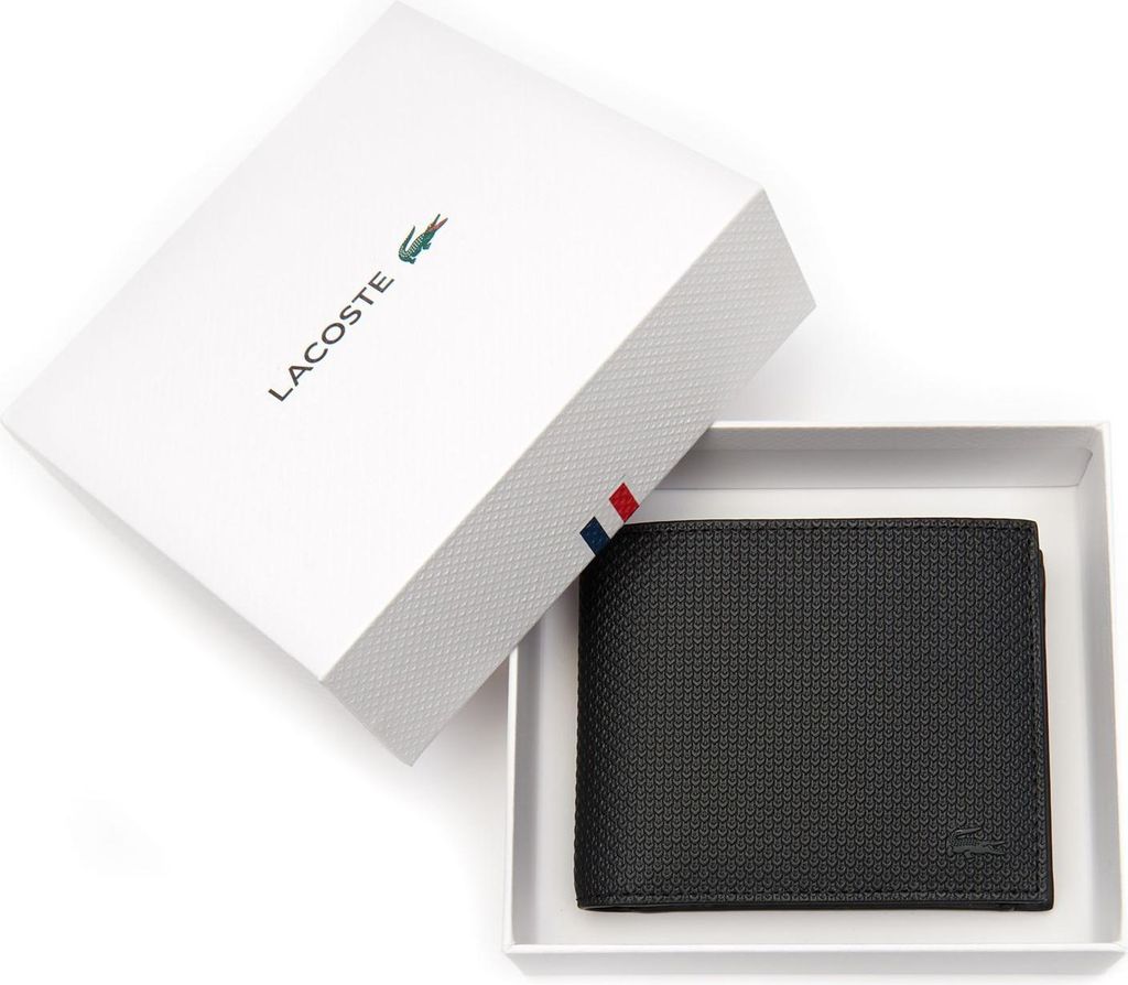 A black Lacoste wallet is presented in its white gift box.