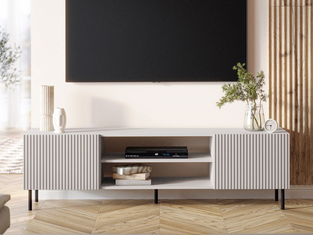 A modern living room with a TV mounted on the wall above a TV stand.