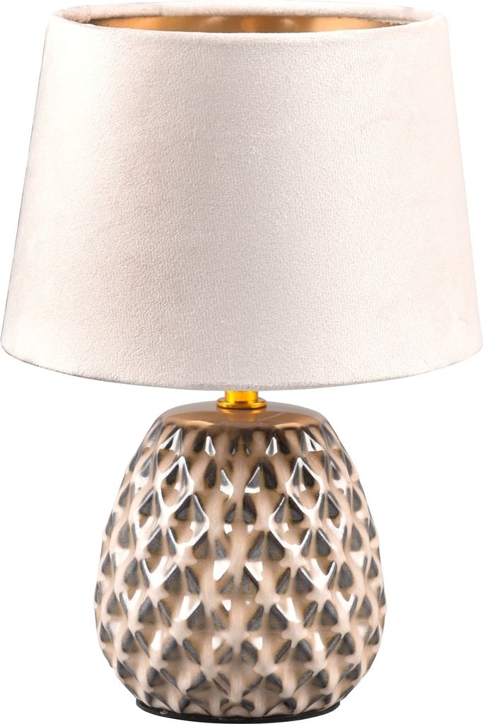 A table lamp with a textured ceramic base and a fabric lampshade.
