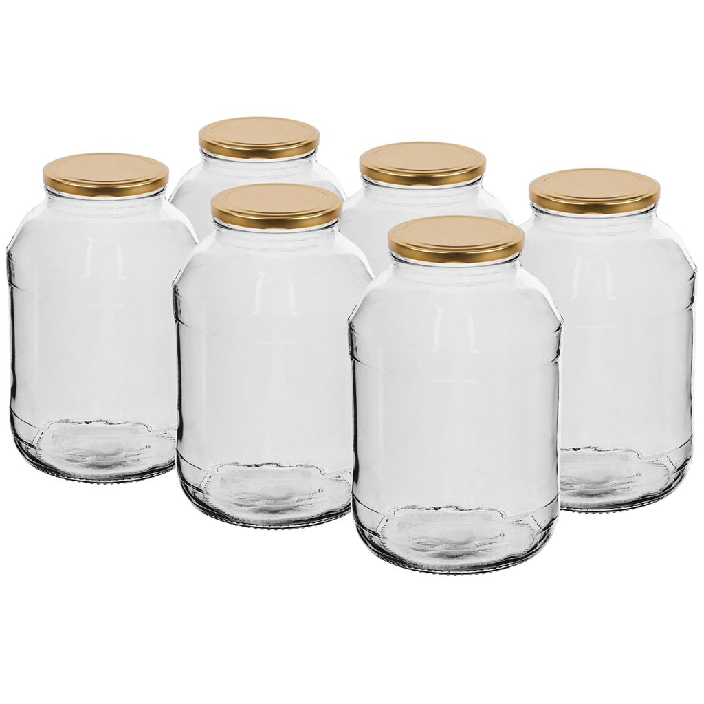 Six clear glass jars with gold lids are arranged in a group on a white background.