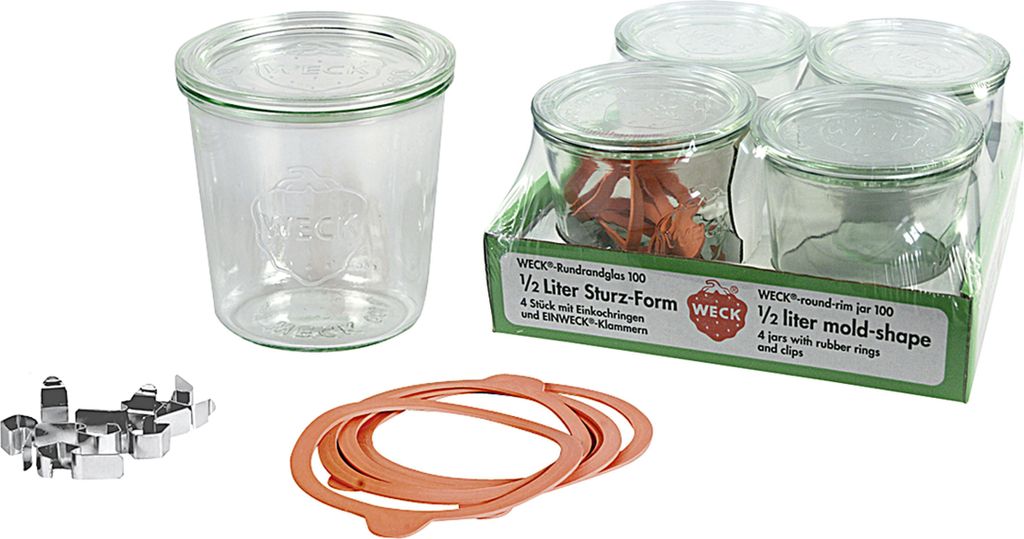 A collection of glass jars and accessories for canning or preserving.