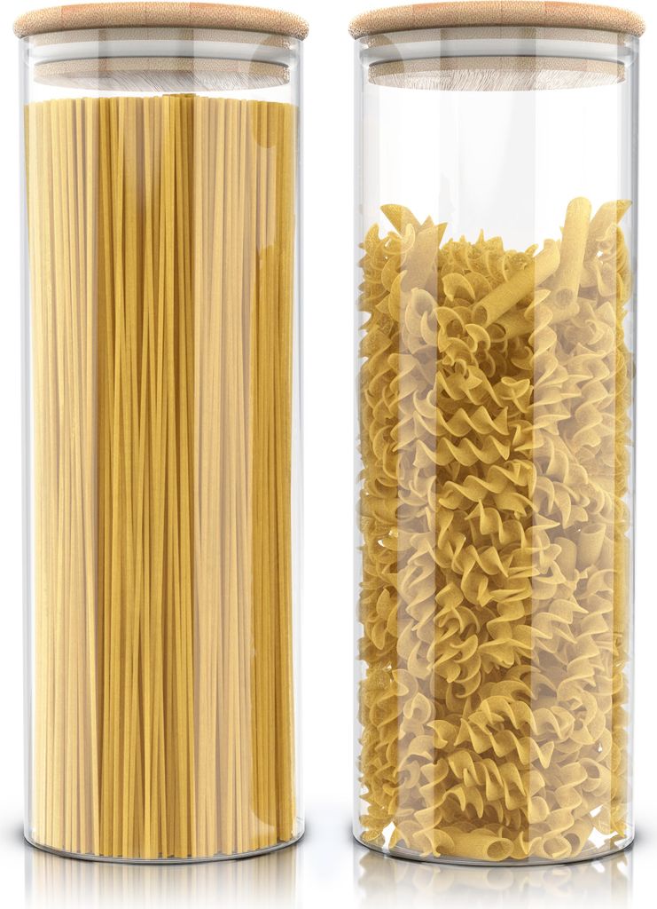 Two glass storage jars filled with pasta, one with spaghetti and the other with fusilli, are shown side-by-side on a white background.