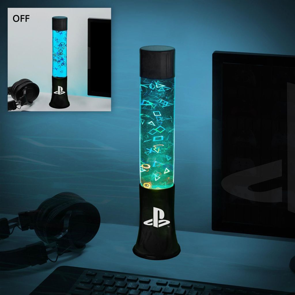 A PlayStation-themed lava lamp is shown on a desk next to a computer monitor and headphones, with a smaller inset image showing the lamp in an 'OFF' state.