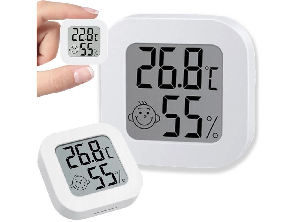 A hand is holding a small digital thermometer and hygrometer, with a larger one in the background.