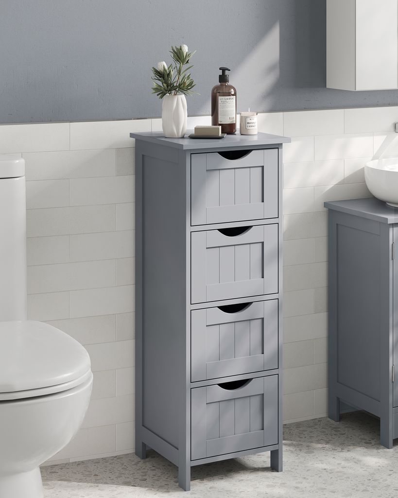 A gray bathroom cabinet with four drawers is shown next to a toilet, with a sink and another cabinet visible in the background.