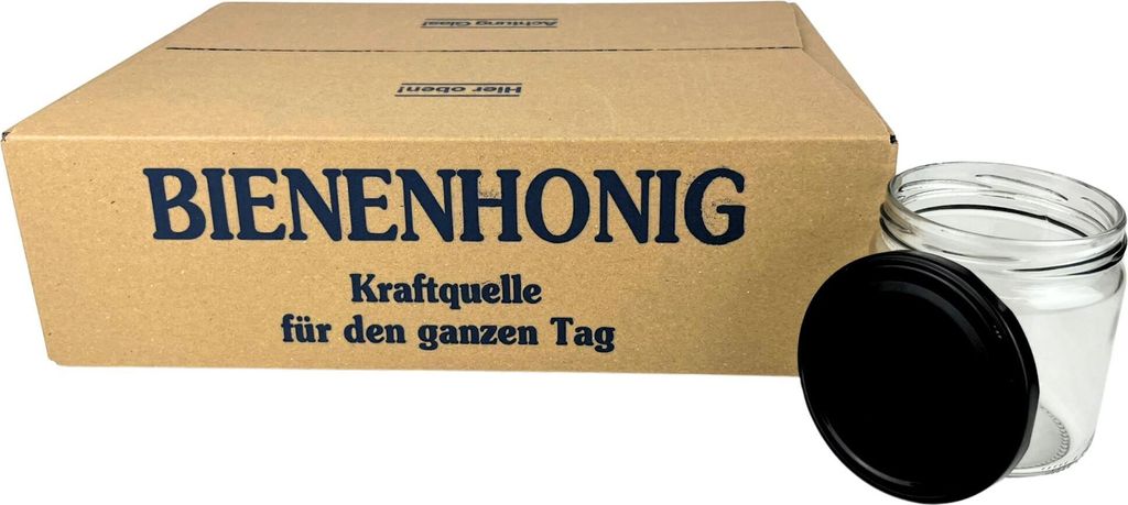 A cardboard box with text and a glass jar with a lid.