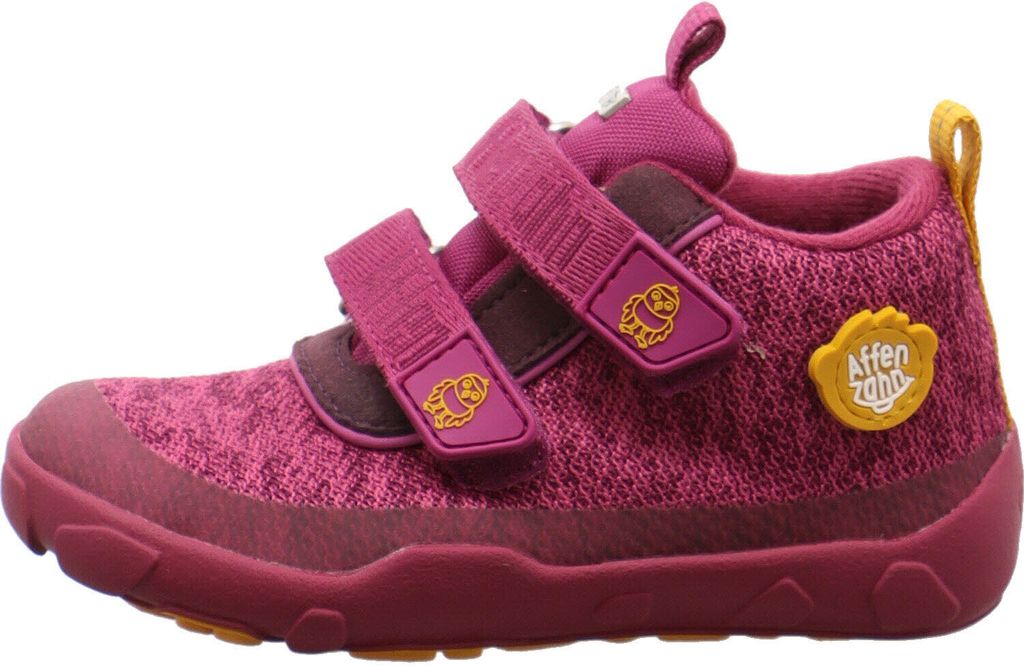 A side view of a pink child's shoe with yellow accents.