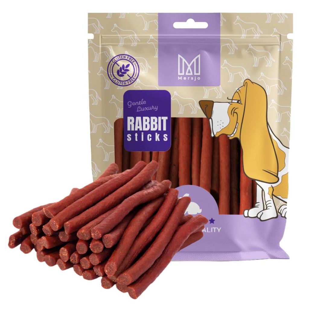 A bag of dog treats with some treats spilled in front.