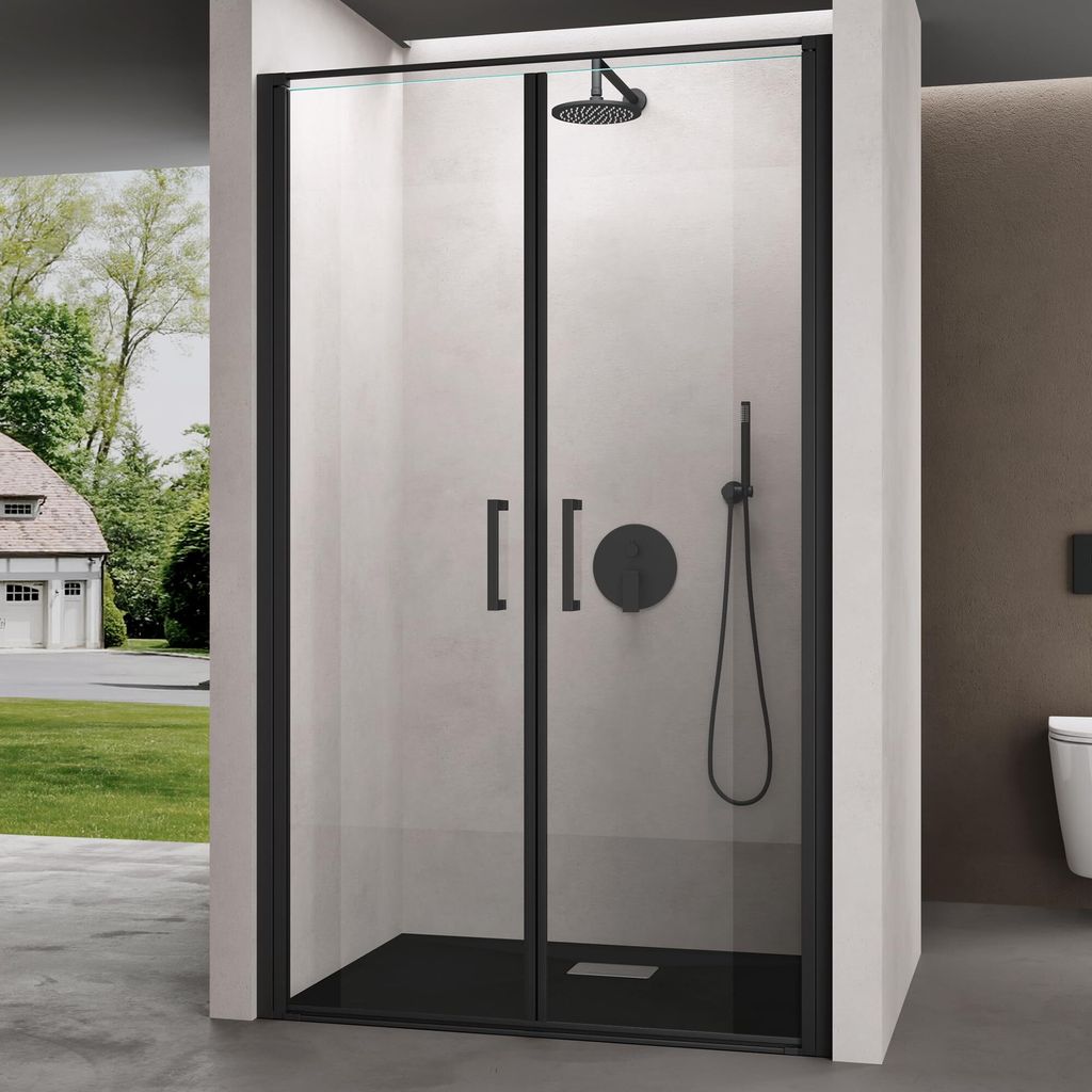 A modern shower enclosure with black framing and clear glass doors, set against a light gray tiled wall and a brown wall, with a view of a house and garden through a side opening.